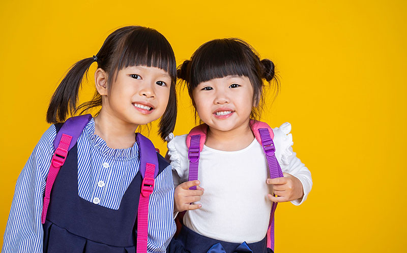 young happy asian toddler girls